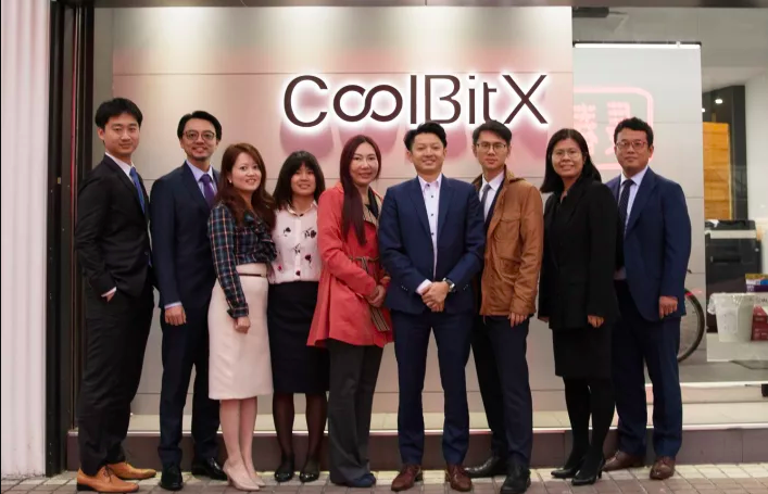 Michael Ou and CoolBitX team members outside the company's Taipei headquarters